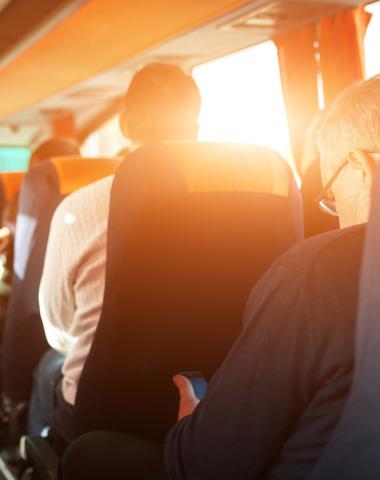 People in a shuttle bus